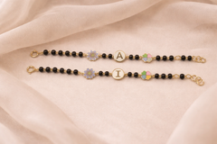 Personalised Black Bead Kids Bracelet with Initial & Floral Charms 4.10 Grams a Pair , 18KT Gold