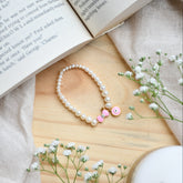 Sweet Charm - Pink Bow Bracelet 0.85 Grams, 18KT Gold