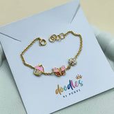 Butterfly Cupcake Flower Charm Bracelet 2.21 Grams, 18KT Gold