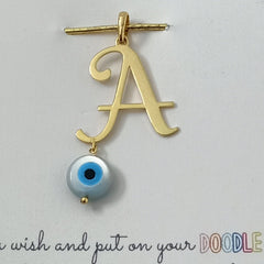 Initial with evil eye pendant 1.36 grams