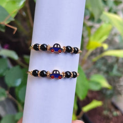 Little Luxe: Playful Car Charm Black Bead Kada for Kids 18kt Gold 9.42 grams