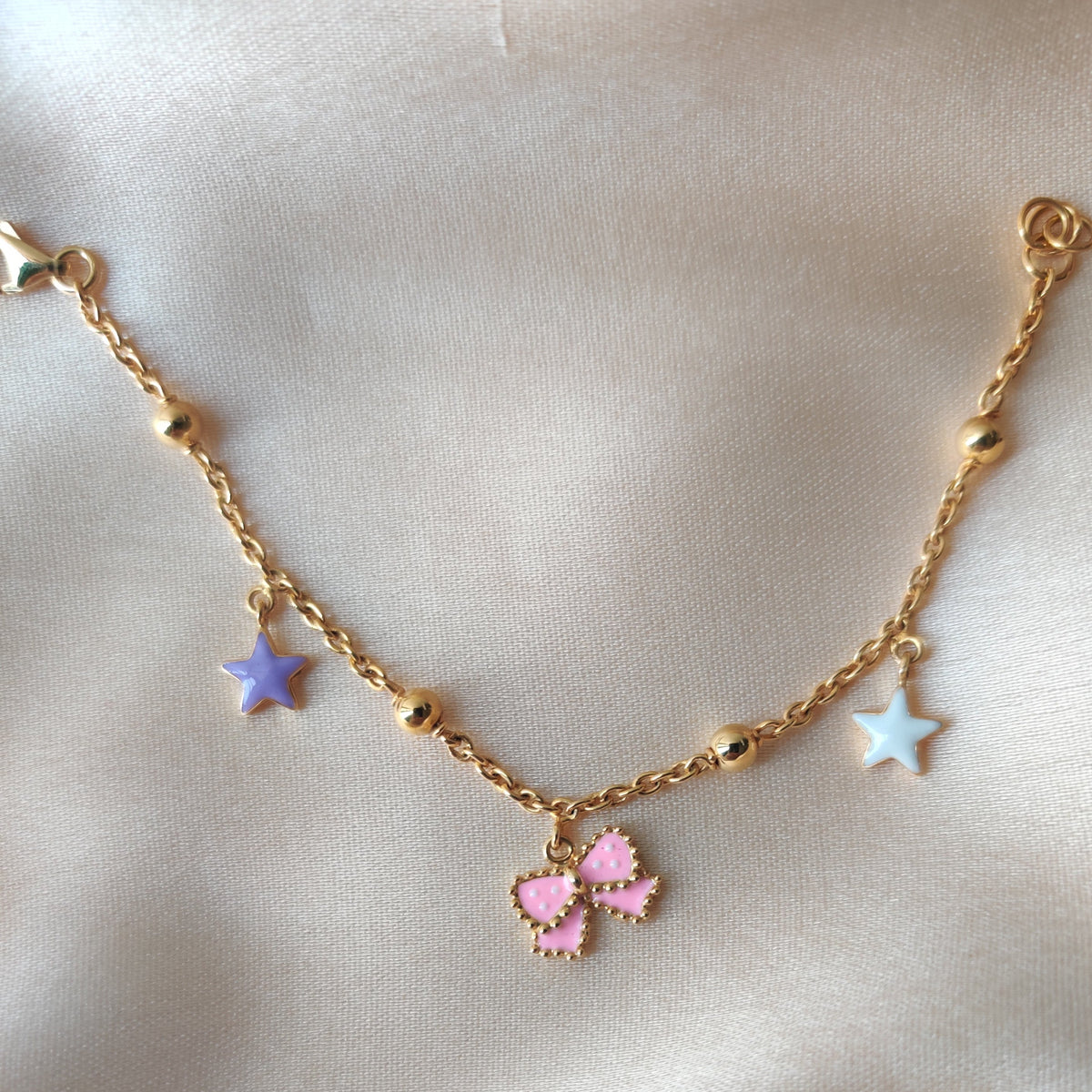 Whimsical Star & Bow Bracelet 3.53 Grams, 18KT Gold