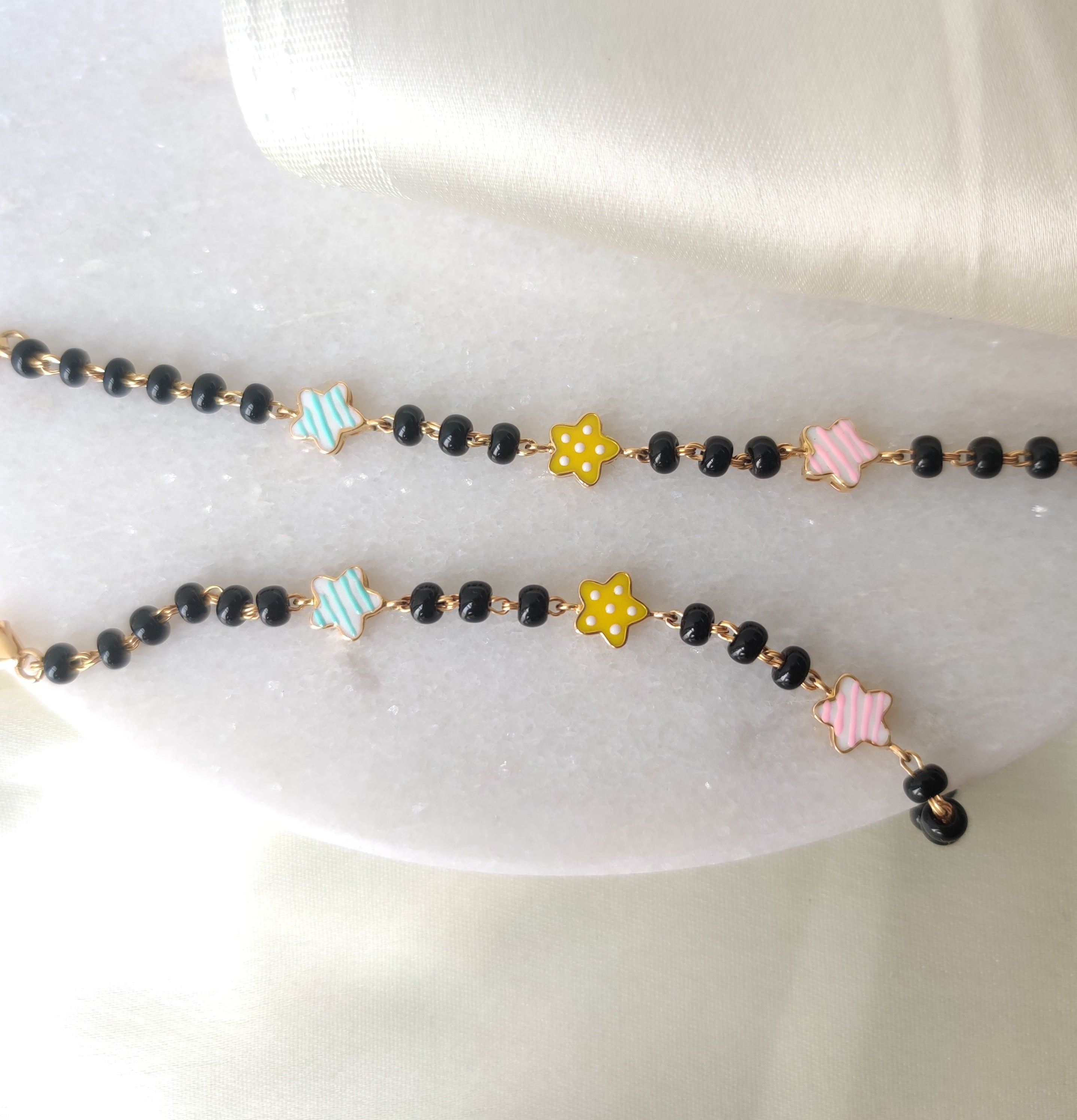 Three Star Nazariyas 5.29 Grams Pair, 18KT Gold