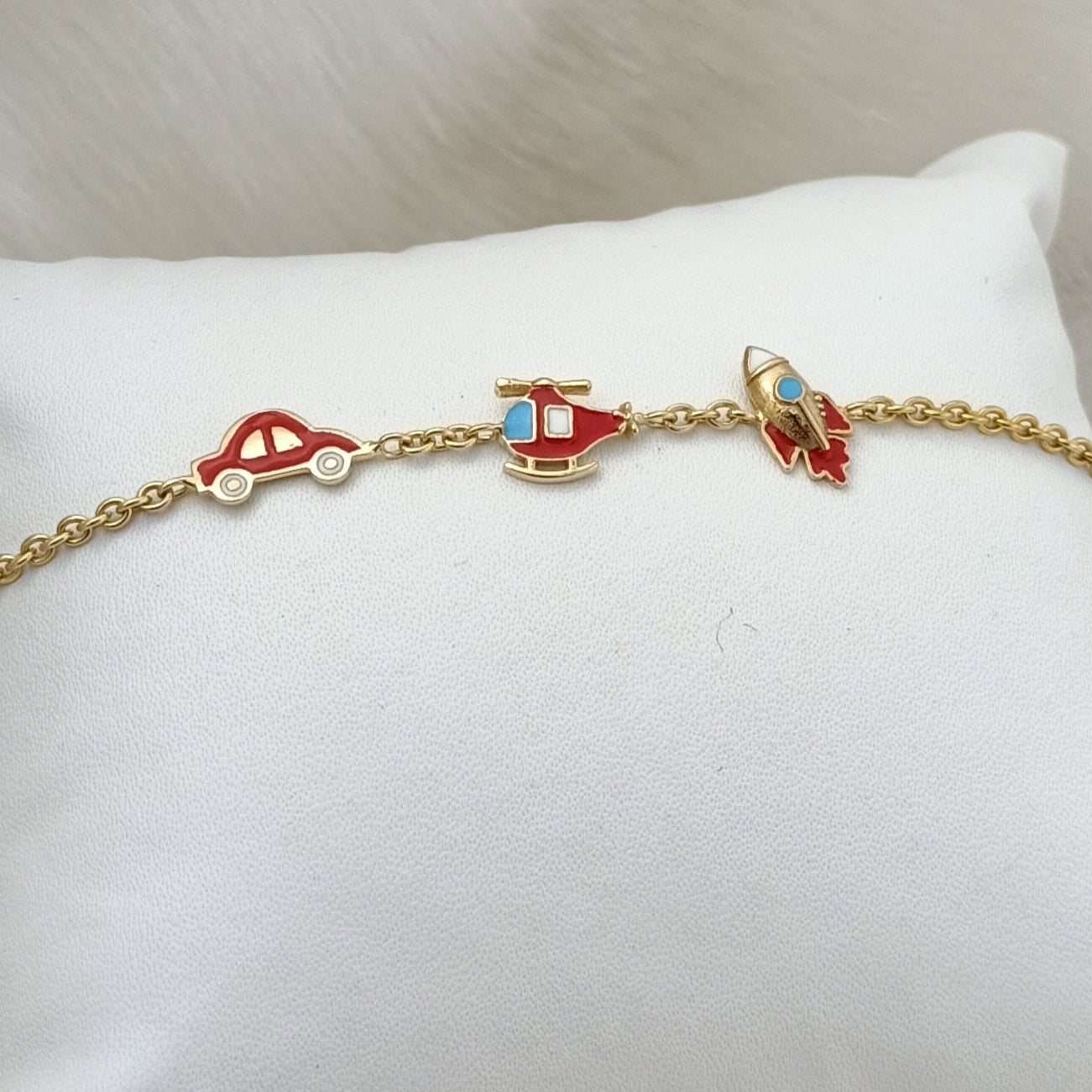 Travel Trio Charm Bracelet 3.5 grams. 18kt gold