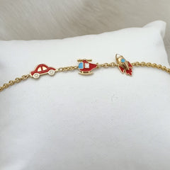 Travel Trio Charm Bracelet 3.5 grams. 18kt gold